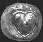 A Cyrenian coin from the 6th century B.C., with a silphium seed imprinted in it. KURT BATY/FAIR USE